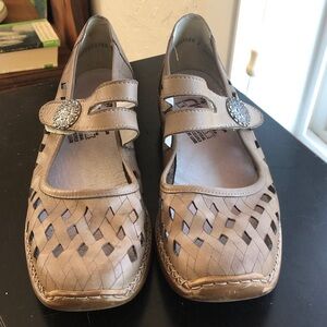 Born goldish tan Mary Jane style with cutouts size 39